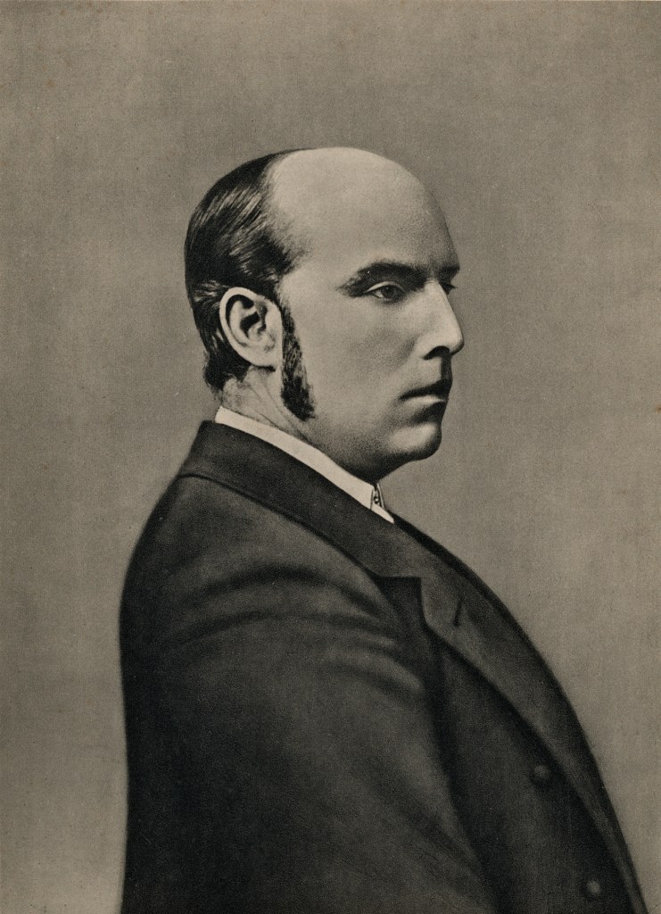 A vintage portrait of a man in profile, wearing a formal suit with a high collar, showing a thoughtful expression.